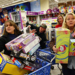 Eager Retailers Greet Crowds Of Shoppers On “Black Friday”